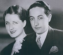A man and a woman looking into the camera