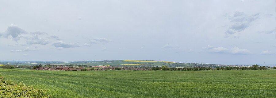 Panoramic view of Halidon Hill (centre) in 2023. The town of Berwick Upon Tweed is to east, on North Sea coast.