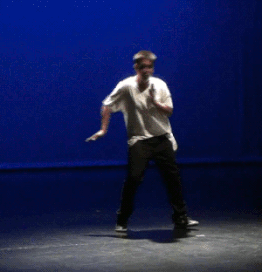 A hip-hop dancer demonstrates popping.
