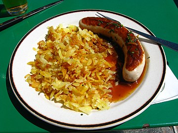 Rösti with veal sausage and onion sauce[2]