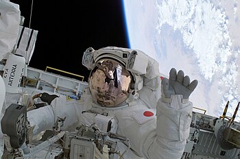 Japanese astronaut Soichi Noguchi waves during STS-114 mission.