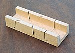 The sides of a basic mitre box act as a fence.