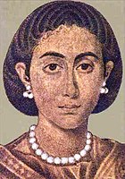The right figure, with a hair style peculiar to Egypt