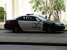 A marked ACPD Chevrolet Impala patrol vehicle.