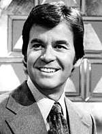 A black-and-white head shot of Dick Clark