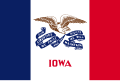 The flag of Iowa, a charged vertical triband.