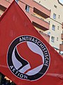 Logo of Antifaschistische Aktion on a red flag