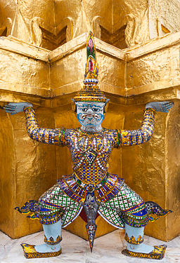 Yaksha (mysthical demon) "lifting" one of the Two Golden Phra Chedis in the Wat Phra Kaew, Bangkok, Thailand.