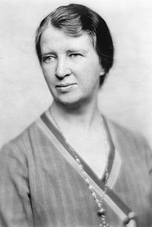 Black and white posed portrait photo of Van Kleeck as a middle-aged woman, with shorter hair and a calm expression, looking to the left of the camera