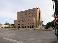 William B. Travis Building is just east of the courthouse.