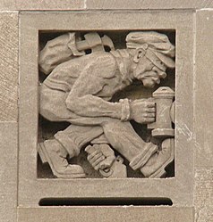 Stone carvings of a burglar on the facade
