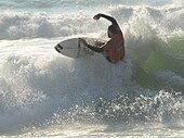 A surfer at Soorts-Hossegor, considered as one of the best surfing spots in the world.[134]