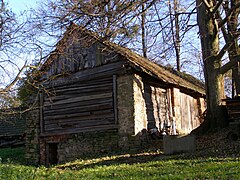 A type of barn in Metylovice, Czech Republic with stone piers and an infill of horizontal timbers.
