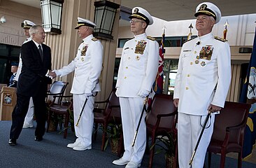 Navy officers in full dress white uniform at the PACOM change-of-command ceremony, Camp Smith, Hawaii, Oct. 19, 2009.