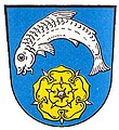 Gemeinde Fischbach In Blau über einer goldenen heraldischen Rose ein gekrümmter silberner Fisch.[1]
