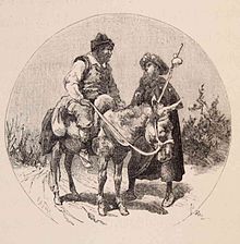 A man in a donkey talks to a man in a pilgrim costume.