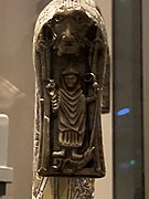 Cleric slaying a dragon with a staff on the drop of the Clonmacnoise Crozier