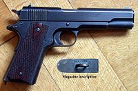 M1911 pistol "British Service Model", which uses the Webley Auto Mk I cartridge. The weapon is stamped with ".455" on the slide and the underside of the magazine