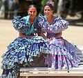 Andalusian women wearing trajes de flamenca