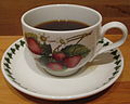 A Portmeirion “botanical” cup depicting strawberries