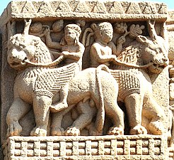 Foreigners holding grapes and riding winged lions, Sanchi Stupa 1, Eastern Gateway.[90]