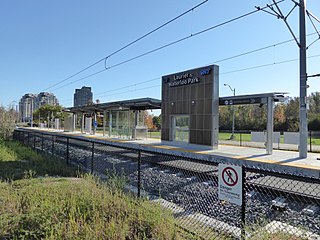 Laurier–Waterloo Park Station, in October 2017, showing the canopy structure and stone-tile feature wall