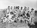Image 16New Guinea Volunteer Rifles with captured Japanese flag, 1942 (from History of Papua New Guinea)