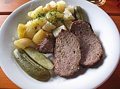 Meatloaf with potatoes and pickled cucumber