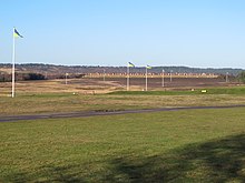 A 1200 yard shooting range with wind flags flying