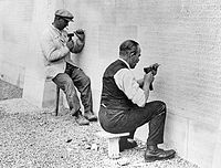 Masons shown carving the names on the Vimy Memorial