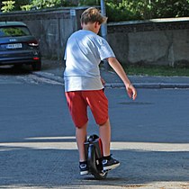 Boy riding an electric unicycle