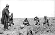 Romanian and Soviet soldiers talking near Stalingrad, late 1942. The latter were theoretically prisoners of the former, but not for long