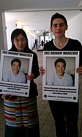 Dhondup Wangchen's wife Lhamo Tso (left) protesting on his behalf