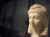 Possible sculpted head of Cleopatra VII wearing an Egyptian-style vulture headdress, discovered in Rome, either Roman or Hellenistic Egyptian art, Parian marble, 1st century BC, from the Capitoline Museums[432][433]