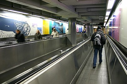 The moving walkway connecting the premetro station with the metro station