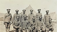 Bermuda Contingent of the Royal Garrison Artillery soldiers in a Casualty Clearing Station, July, 1916, wear Service Dress with small arms ammunition bandoliers (for rifles used for defensive purposes).