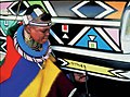South African artist Esther Mahlangu painting in the distinctive Ndebele house painting style.