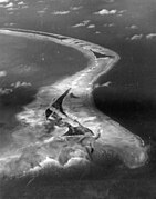 Aerial view of Betio Island looking east, before invasion of the island by U.S. Marines, 18 September 1943. The image was taken by an aircraft from Composite Squadron 24.