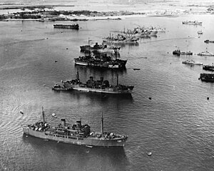 Aerial photo of target ships anchored in a row at Pearl Harbor, Hawaii.