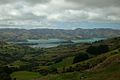 View of Akaroa harbour; the long, thin peninsula extending out into the harbour is Ōnawe Peninsula, and the middle of the volcano