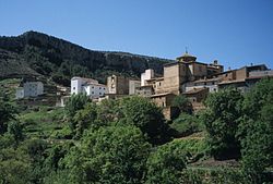 View of Calmarza with the Sierra de Solorio cliffs above the town