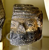 Damaged basalt head of a foreigner, from a door socket. Early Dynastic Period, 1st to 2nd Dynasties. From Thebes, Egypt.