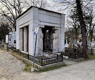 Mature - Grave of the Străjescu Family, Bellu Cemetery, Bucharest, by George Cristinel, 1934[86]