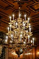 Chandelier fitted with flame-shaped light bulbs