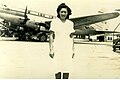 Rebecca Chan Chung at Longhua Airport, in front of a CNAC Curtiss C-46 (c.1947)