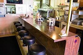 A lunch counter in a very small restaurant