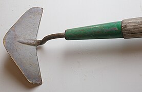 A Dutch hoe or push hoe; usually attached to a long hilt and handle