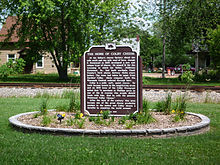 Historical marker titled "The Home of Colby Cheese"