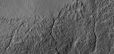 Close view of small channels that seem to originate in a mantle layer, as seen by HiRISE under HiWish program