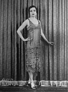 Actress Alice Joyce in a straight dress with a sheer beaded overdress, 1926.